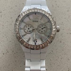 Guess white watch with stones all around and pearl face
